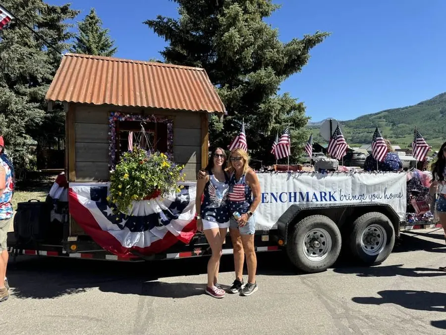 Diane Beaumont with her team at a Crested Butte 4th of July parade with the Benchmark Mortgage float