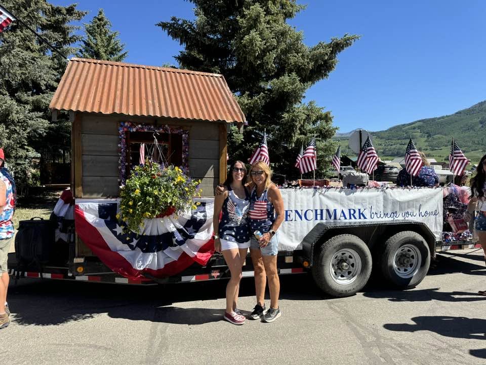 Diane Beaumont with her team at a Crested Butte 4th of July parade with the Benchmark Mortgage float